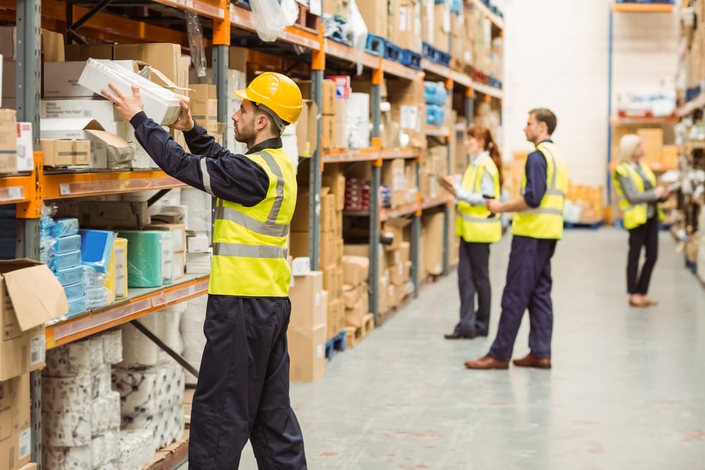 Warehouse worker taking package in the shelf in a large warehouse in a large warehouse-2